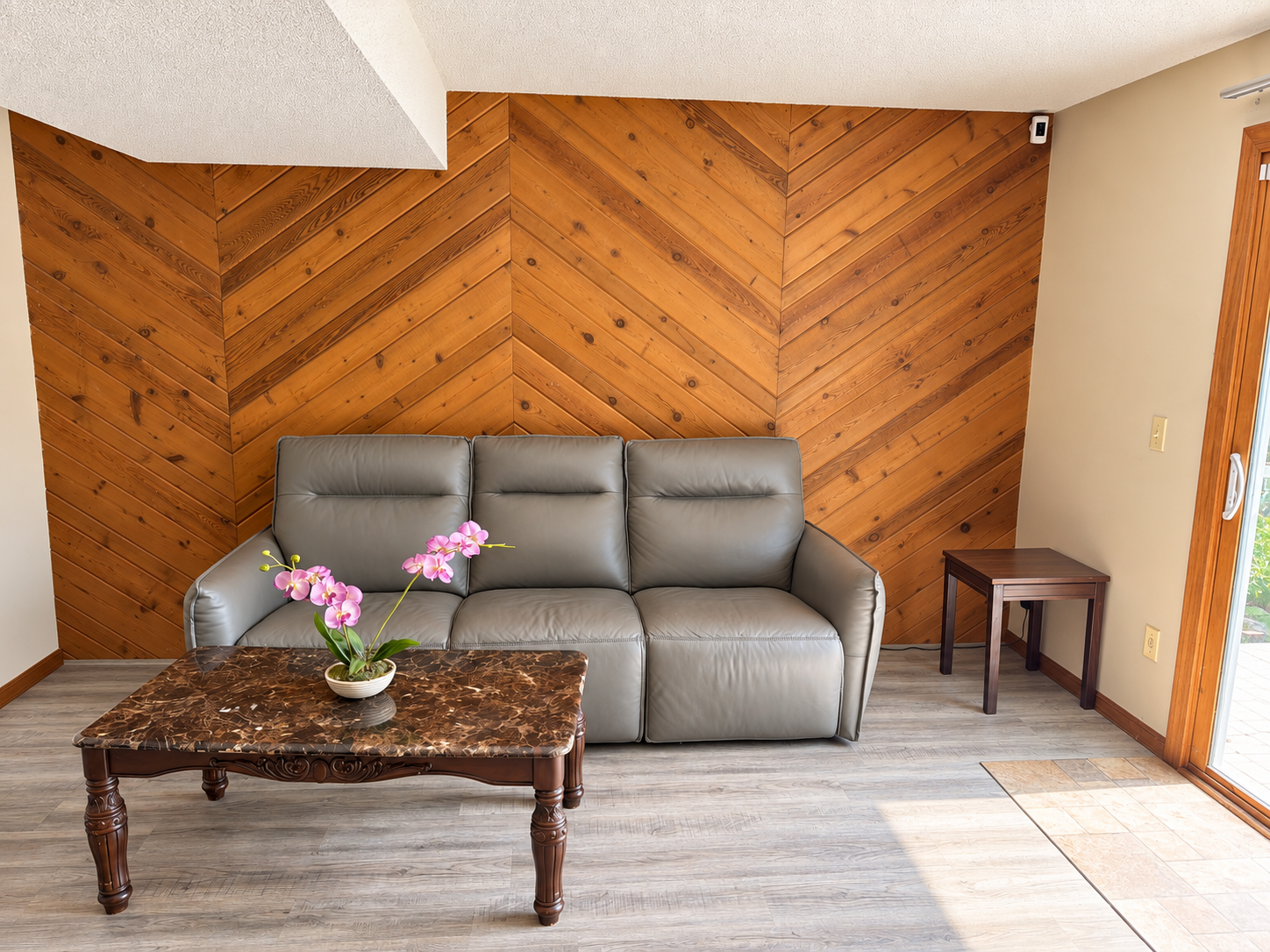 Bright shared sitting room with a wood feature wall